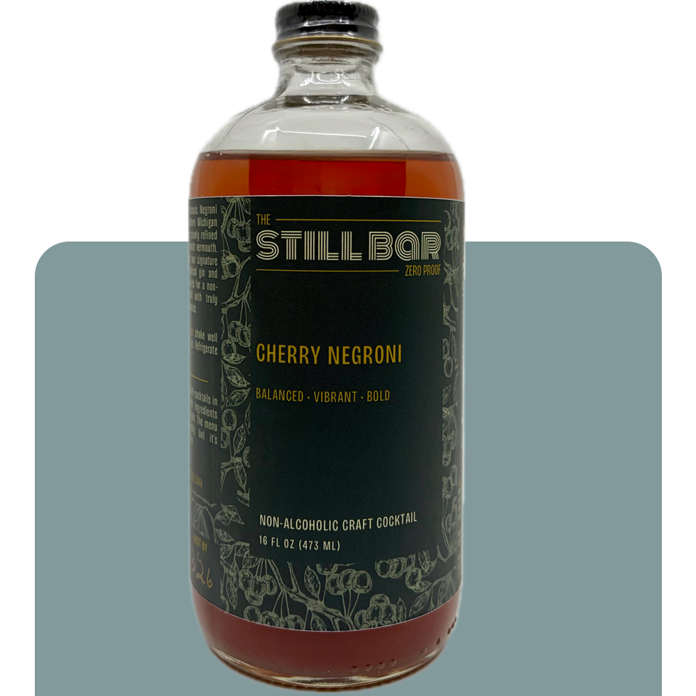 Bottle of The Still Bar Cherry Negroni non-alcoholic craft cocktail on a white background