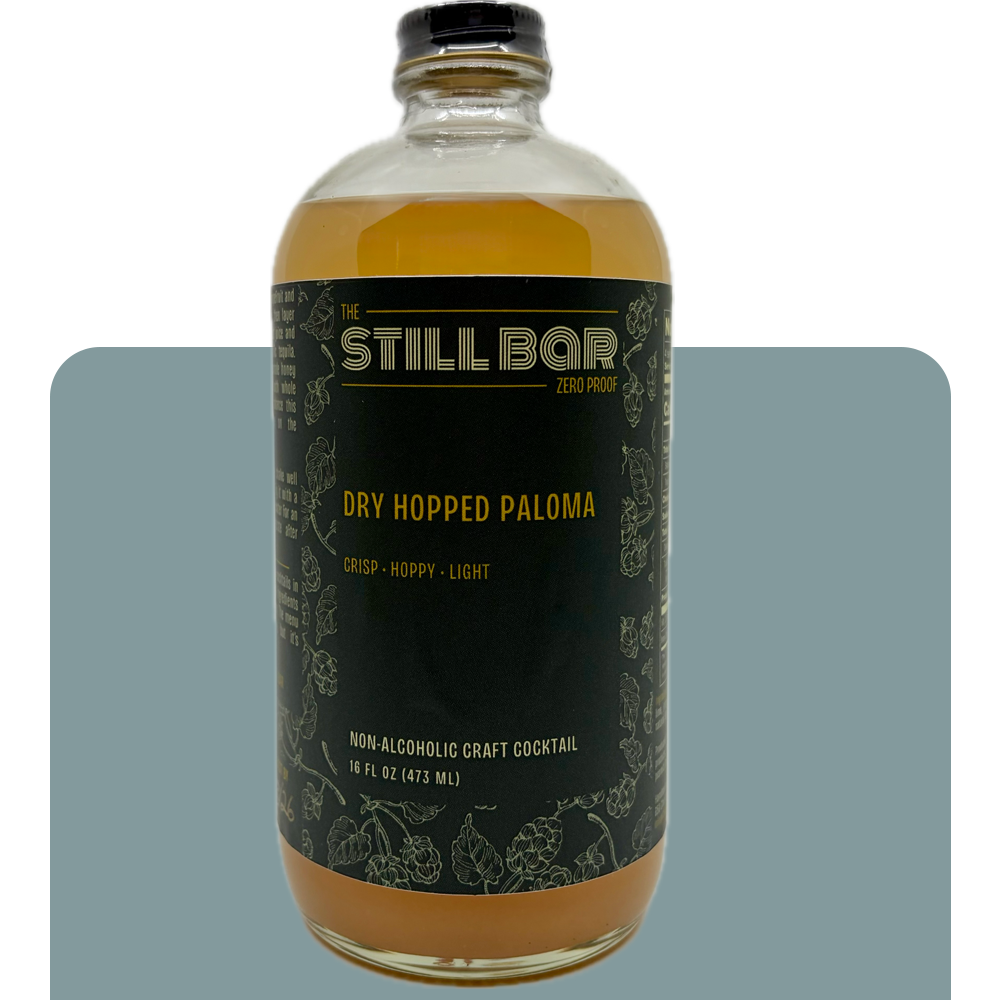 Bottle of The Still Bar Dry Hopped Paloma non-alcoholic craft cocktail on a white background