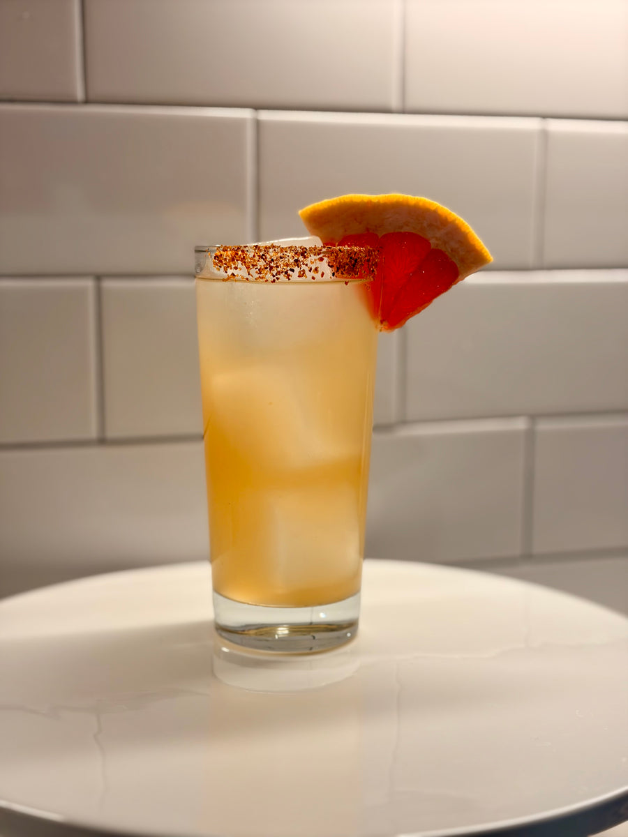Non-alcoholic dry hopped paloma over ice with a grapefruit wedge, The Still Bar